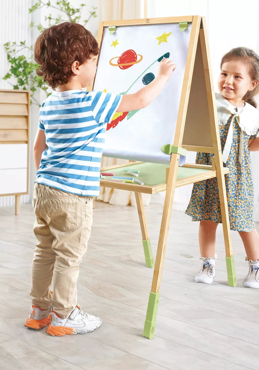 Hape Step up Bamboo Art Easel with two children drawing