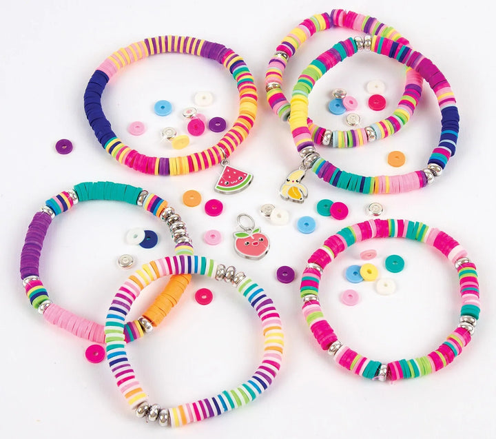 Six colorful beaded bracelets arranged on a white background, each with matching loose buttons, beads, and small charms including a watermelon slice and a duck.