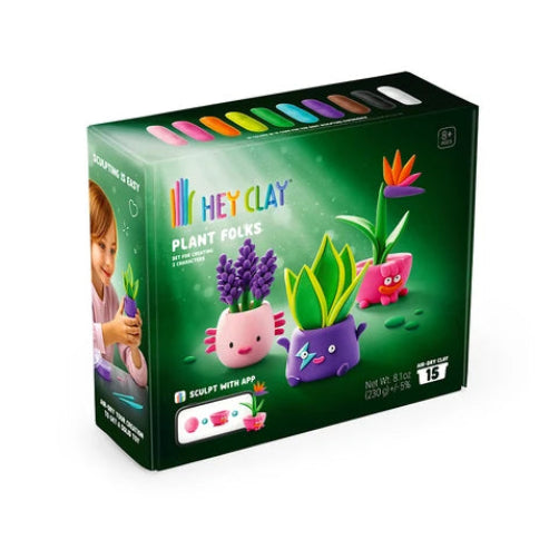hey clay plant folk packaging with dark green background and child pictured moulding the hey clay character