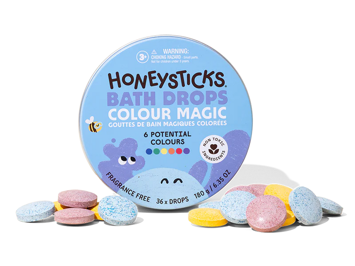 Honeysticks Bath Drops Colour Magic packaging with colorful bath bombs on a white background
