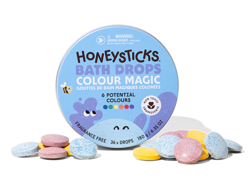 Honeysticks Bath Drops Colour Magic packaging with colorful bath bombs on a white background