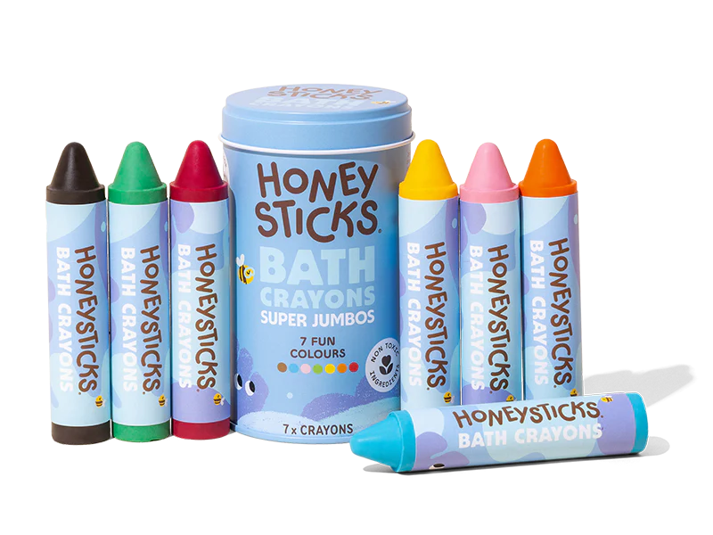 Honey Sticks bath crayons set with a blue tin on a white background