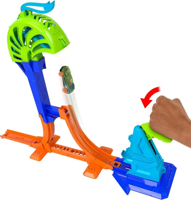 hot wheels Toy track set by mattel with a hand operating a green and blue car on an orange track.