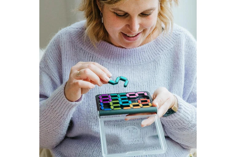 Person playing with a IQ Digits - Smart Game