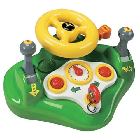 Toy steering wheel and dashboard set on a white background