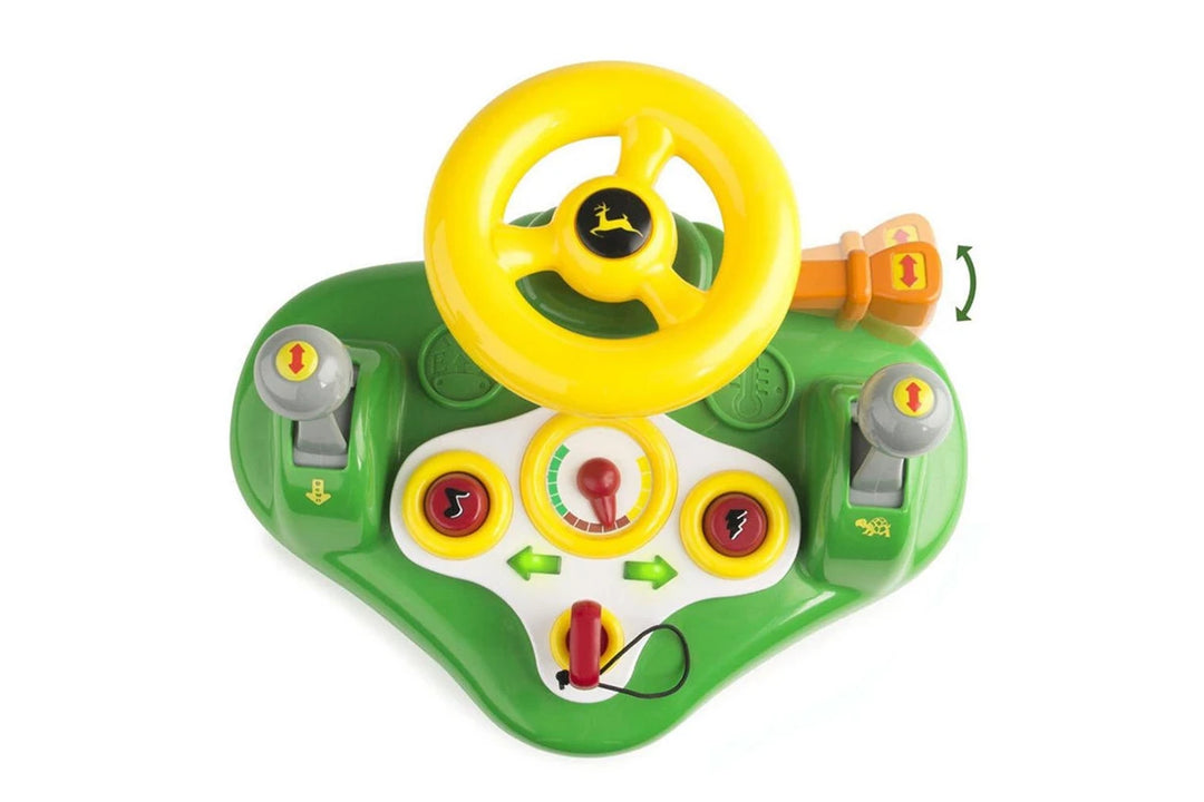 Toy steering wheel and dashboard set on a white background