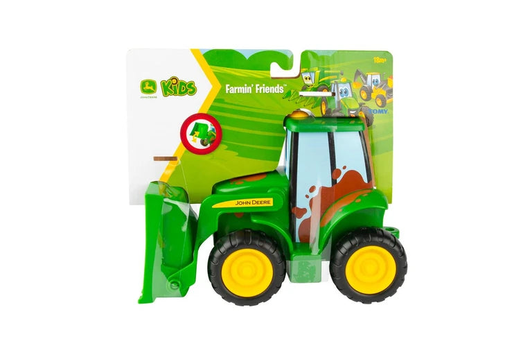 John Deere Farmin' Friends toy tractor in its original retail packaging, featuring a green tractor with yellow wheels and a brown mud splatter design.