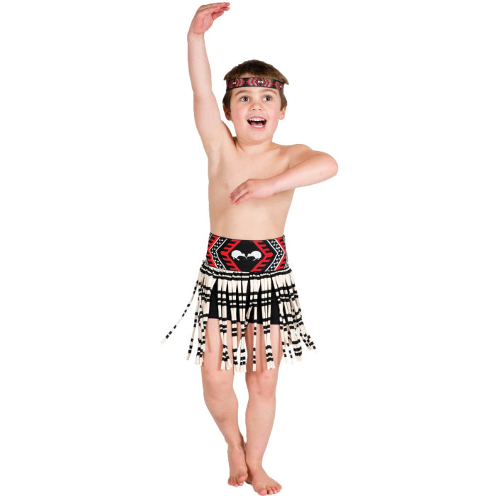 Child wearing a Maori inspired costume with a skirt and headband on a white background