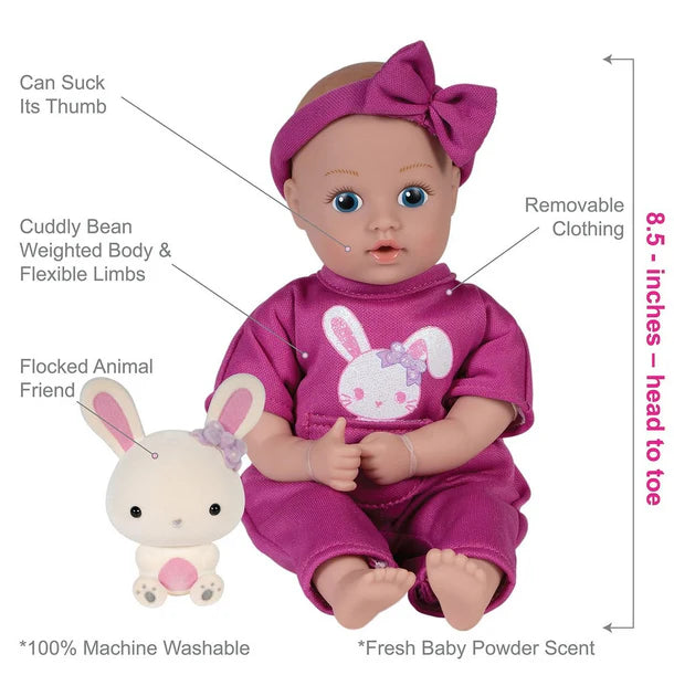 adora be bright tot Baby doll with purple outfit and headband, accompanied by a flocked animal friend, on a white background.