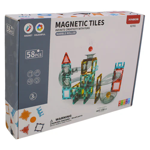 Box of magnetic tiles marble run with colorful design and toy structure on a white background