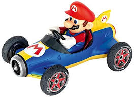 Toy car with a character in a red hat and blue outfit driving it on a white background