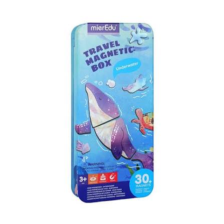 A merEdu Travel Magnetic Box underwater set in a blue metal tin package, featuring a large purple whale illustration and a blue background with underwater-themed graphics.