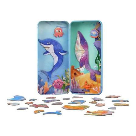 Colorful magnetic puzzle set with sea-themed pieces and a tin box on a white background