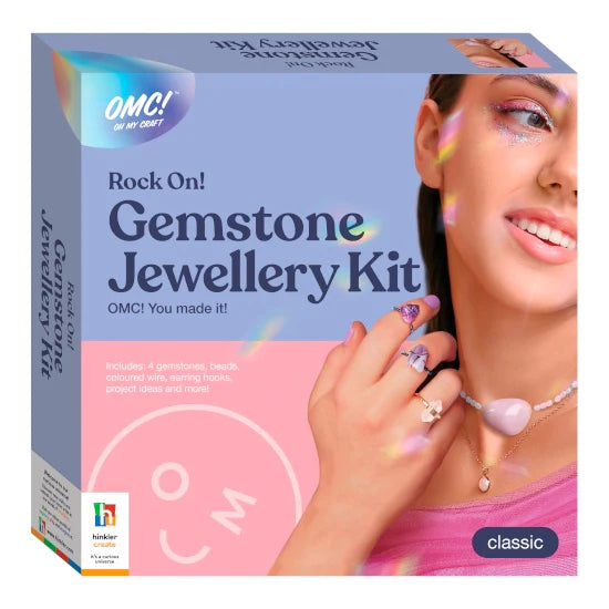 Gemstone jewellery kit packaging with a woman wearing a necklace, OMC branding visible