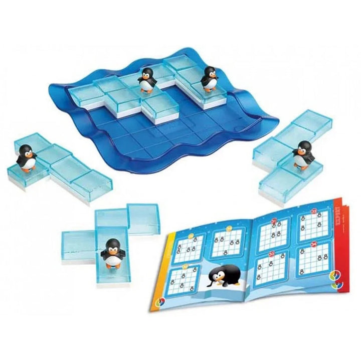 Penguin ice age board game set with a blue wavy game board, translucent icy tiles, penguin tokens, and an open instruction booklet on a white background.