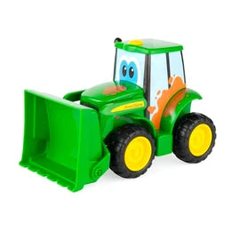 A green toy front loader tractor with yellow wheels, a green front bucket, and cartoon eyes on the windshield, isolated on a white background.