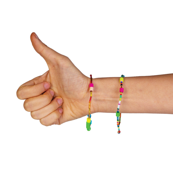 Hand giving a thumbs-up with colorful beaded bracelets on a white background