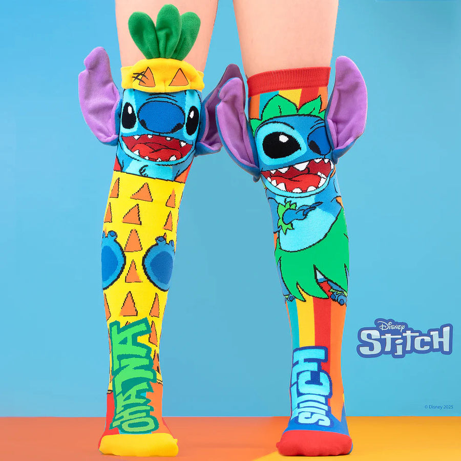 Colorful socks with cartoon character design on a blue and orange gradient background