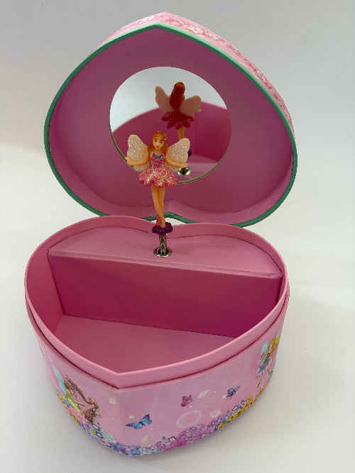 A pink heart-shaped music box jewelry box with a mirror on the inside lid and a small fairy figurine on the spinning pin. The exterior is decorated with colorful butterflies and floral patterns.