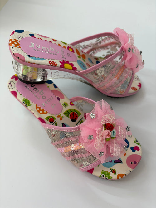 Colorful children's shoes with floral designs and decorative bows on a white background