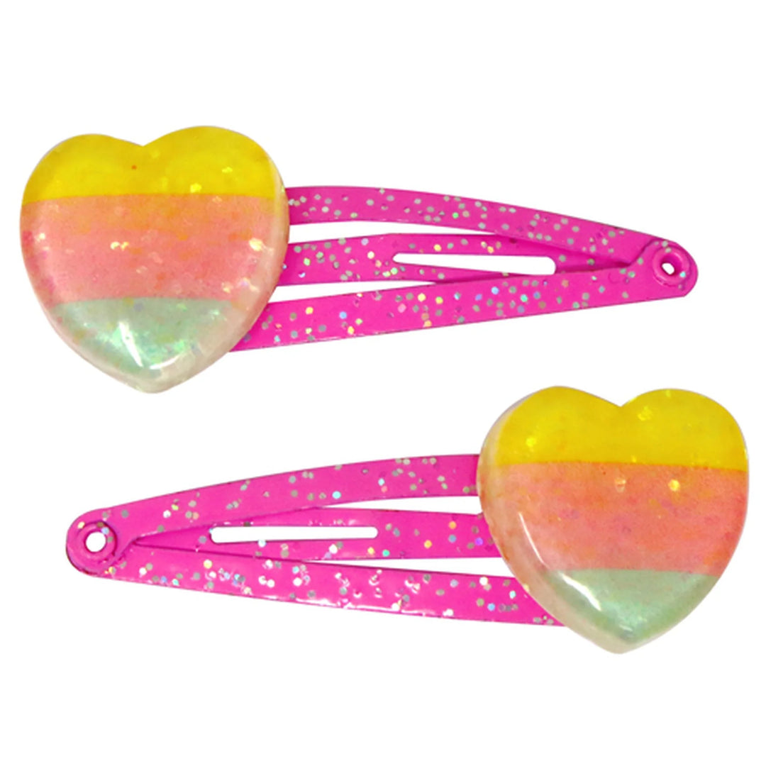 pink hair clips with clear yellow pink and green heart on the ends
