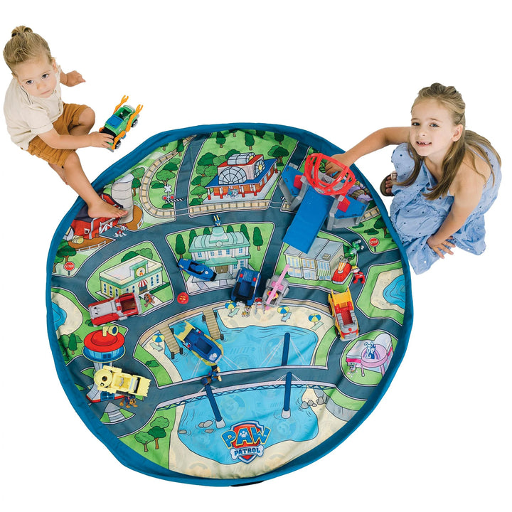 playmat city with toy paw patrol cars and building