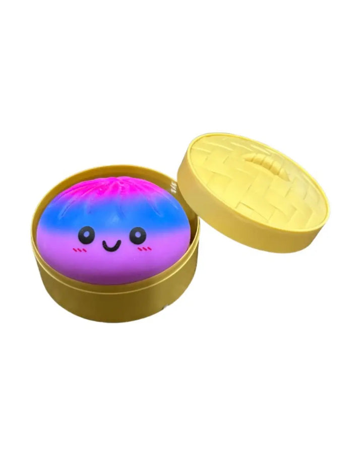 Colorful dumpling with a smiley face in a yellow container on a white background