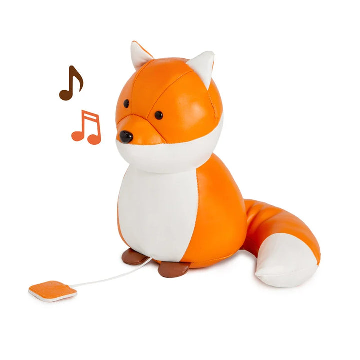 Toy fox with a music player on a white background