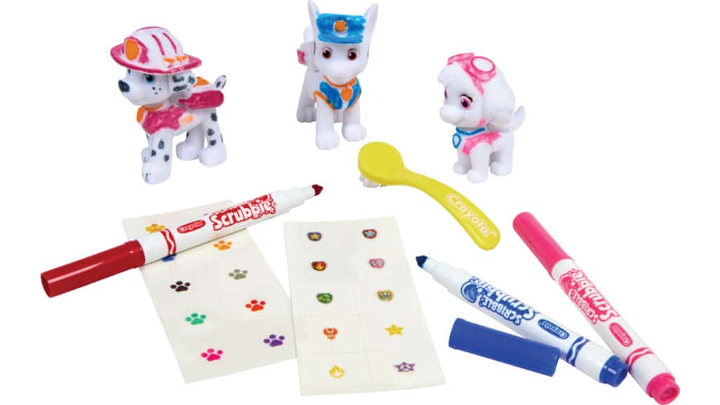 Set of cartoon dog figurines with markers and paper on a white background