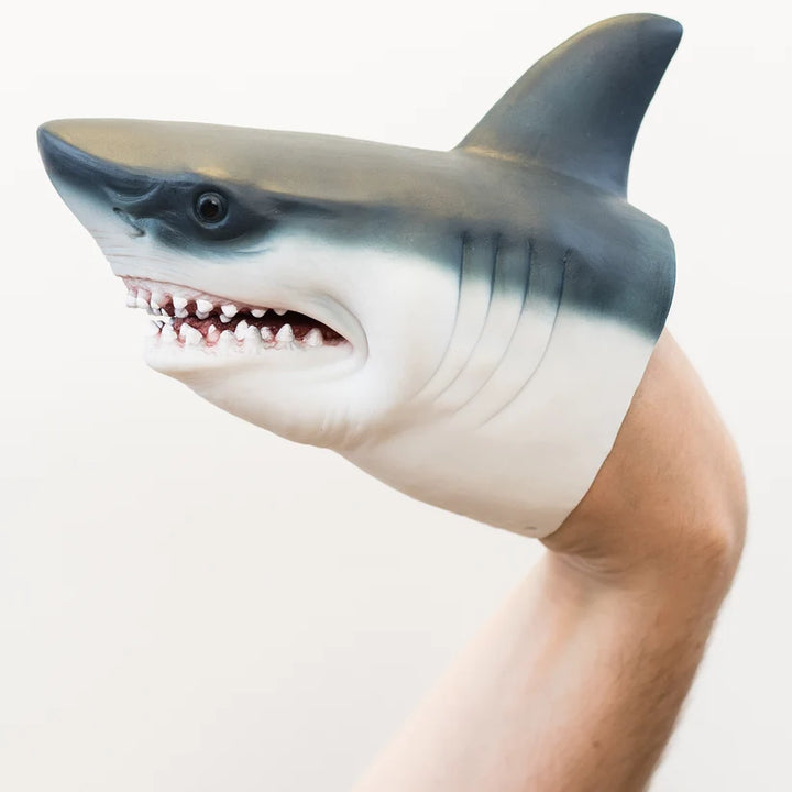 A shark-shaped glove on a wrist costume accessory worn on a person's arm, shown against a plain light background.