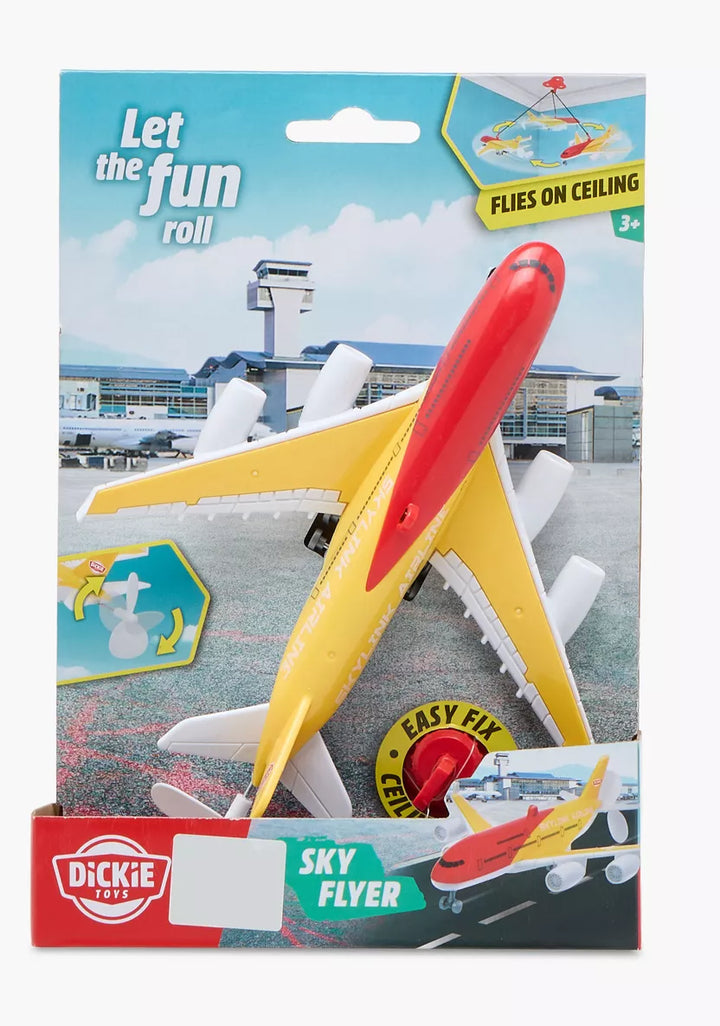 Toy airplane in packaging with airport background