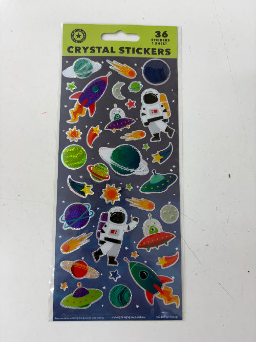 A package of 36 crystal stickers featuring a space theme with astronauts, rockets, planets, and stars on a dark background with a green header.