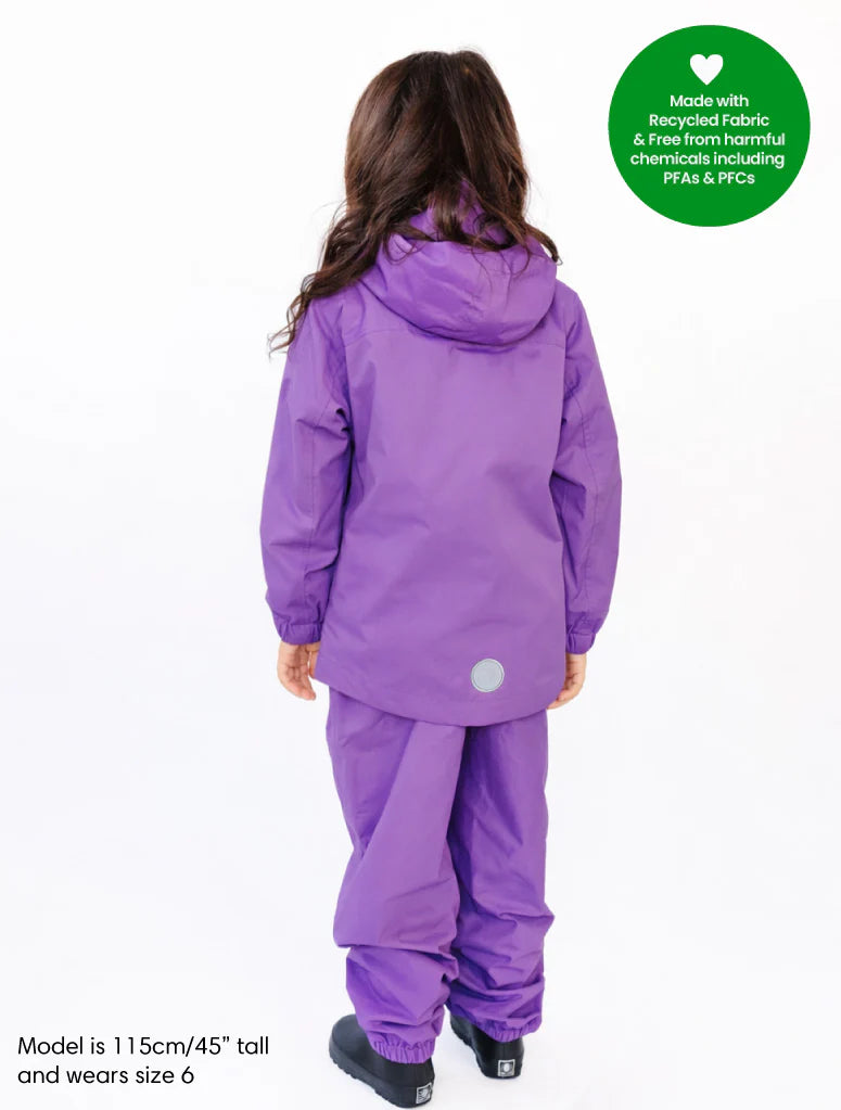 Person wearing a purple raincoat and pants with a green label on a white background