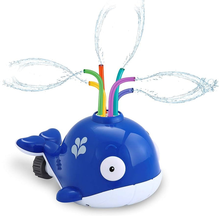 A blue whale-shaped water spray toy with colorful drinking straws shooting water arcs, shown on a clean white background.