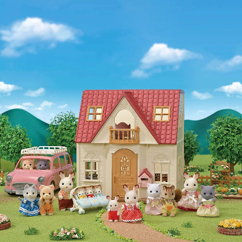 Toy house with toy animals in front of a blue sky