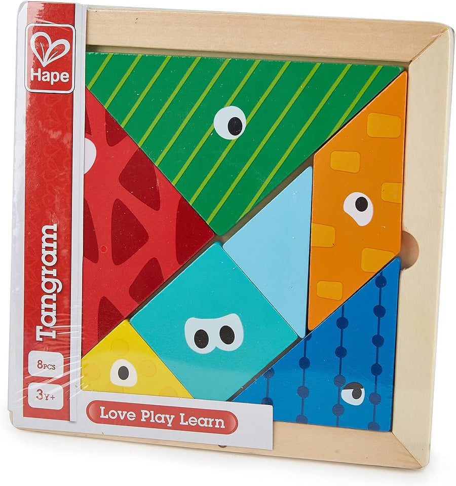 Hape Tangram wooden puzzle box with colorful geometric pieces and animal face cutouts, shown in its retail packaging with a red Hape brand strip on the left.