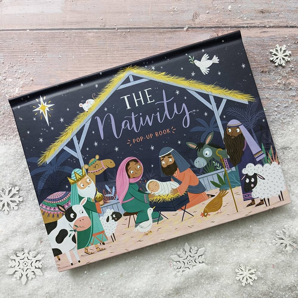 the nativity pop up book on a snowy background