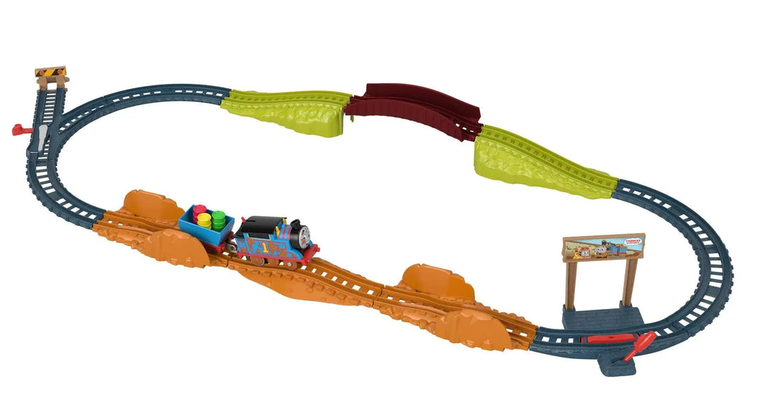 Toy train set with tracks and colorful train on a white background