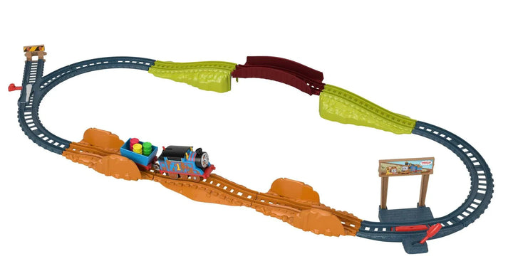 Toy train set with tracks and colorful train on a white background