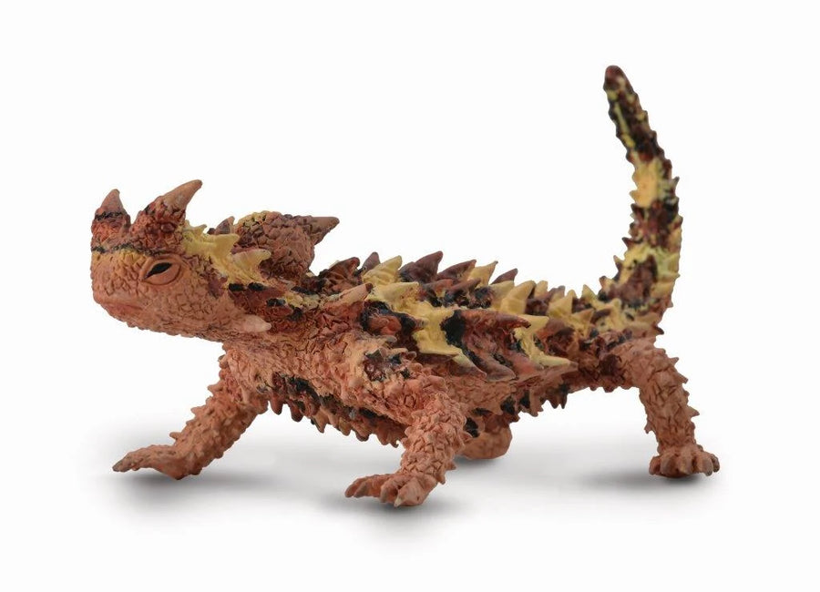 thorny dragon lizard miniature figure over white background