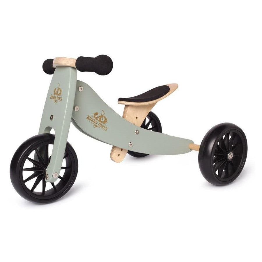 Children's tiny tot plus with wooden seat and black wheels on a white background