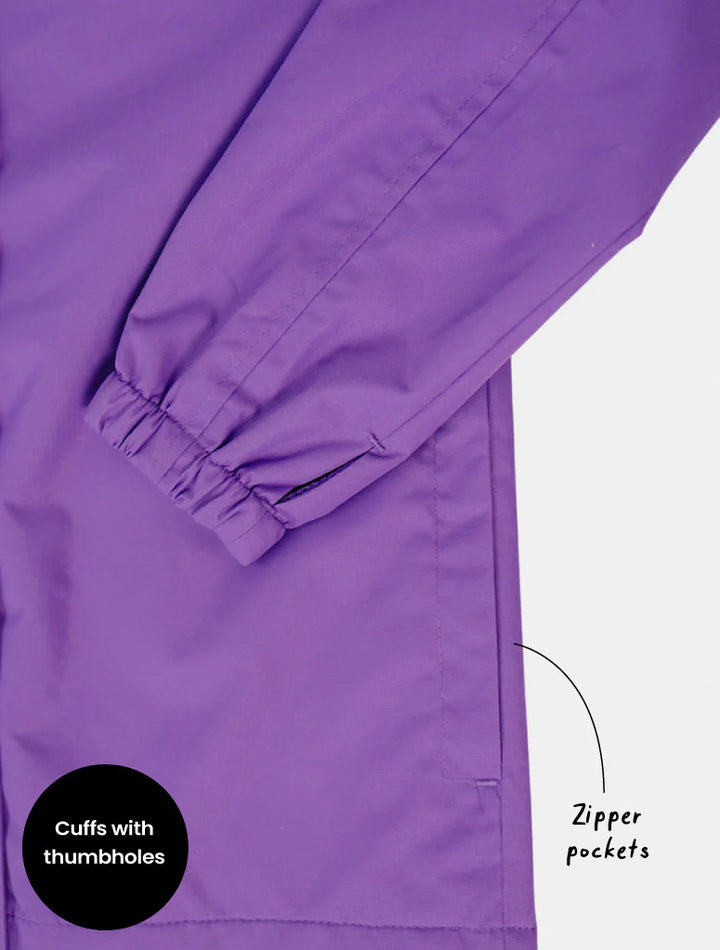 Purple jacket with cuffs and zipper pocket details on a white background