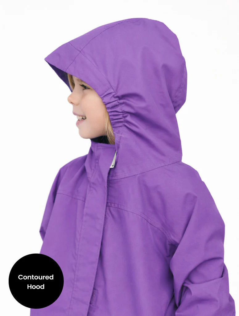 Purple raincoat with contoured hood worn by a child on a white background