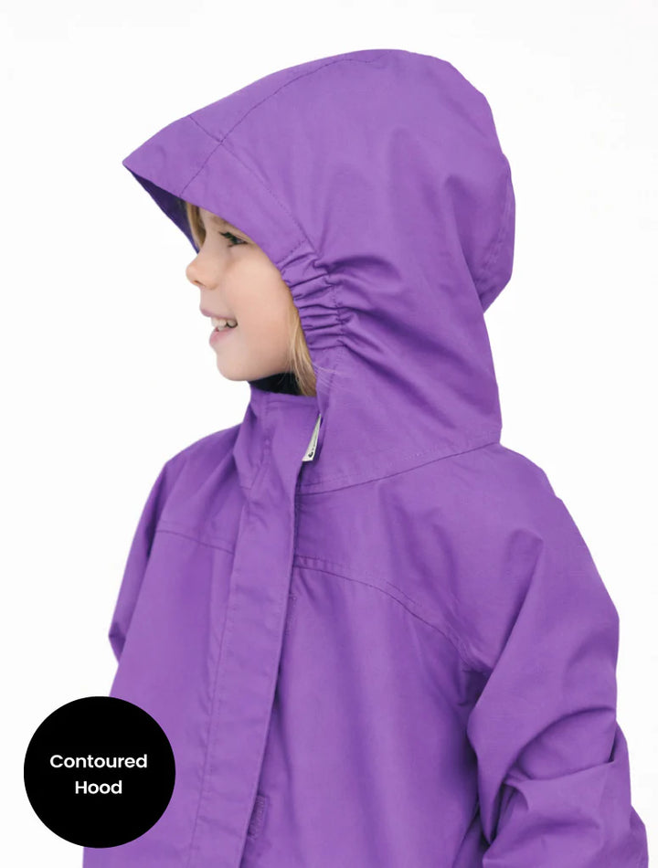 Purple raincoat with contoured hood worn by a child on a white background