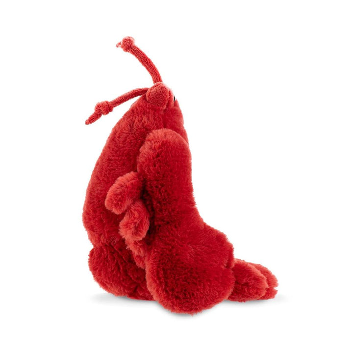 Red plush lobster toy on a white background
