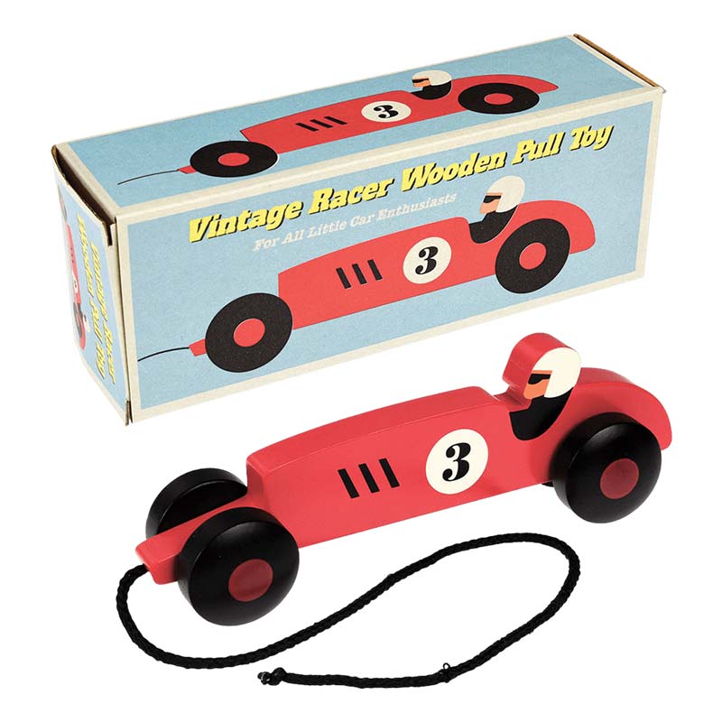 Red wooden pull along on a string car